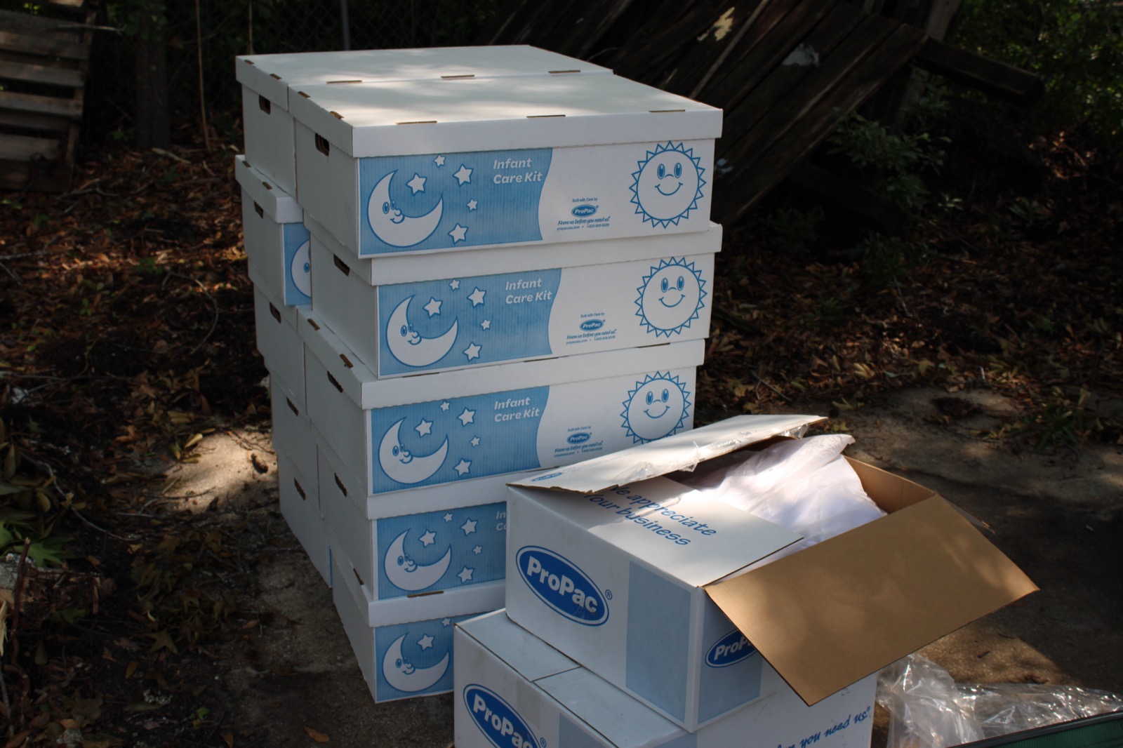 Stacked Infant Care Kit boxes ready for distribution.