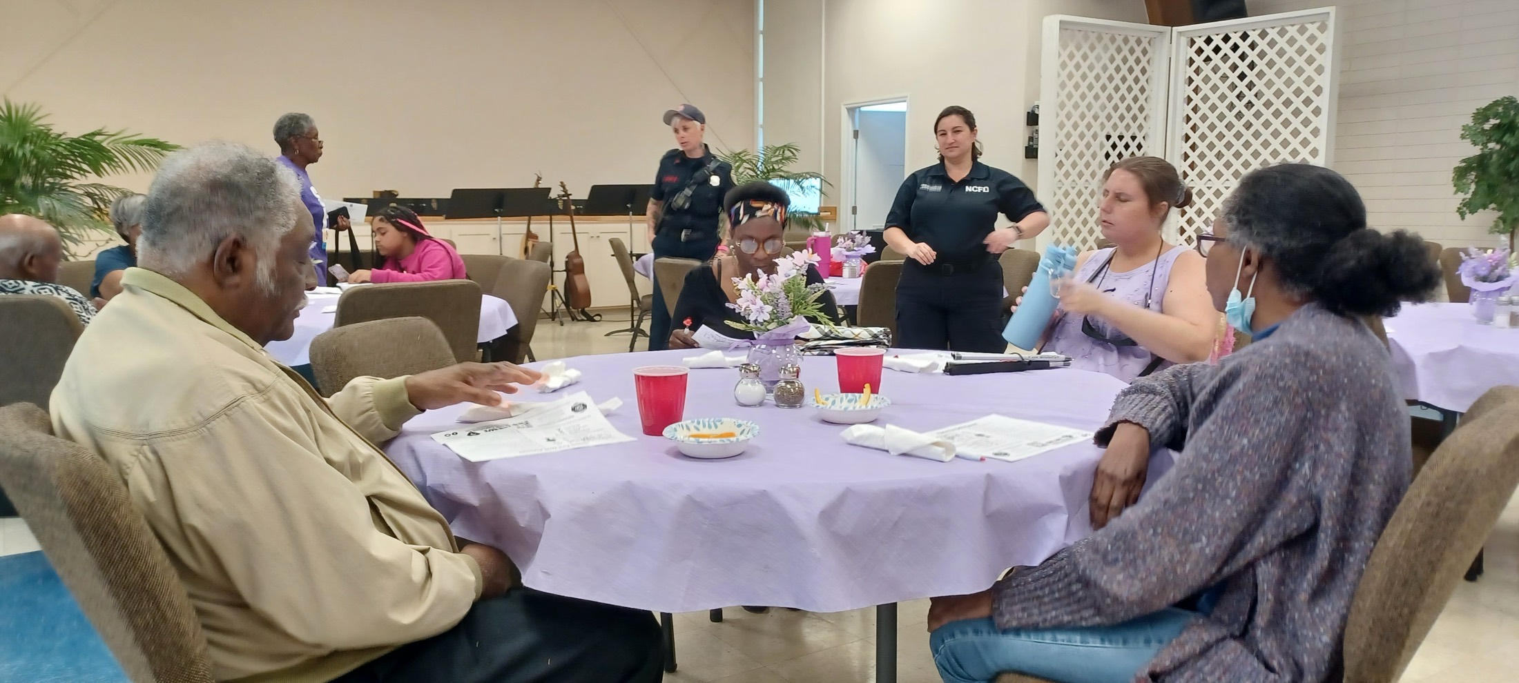 An AccessAbility facilitator leading a group training session.