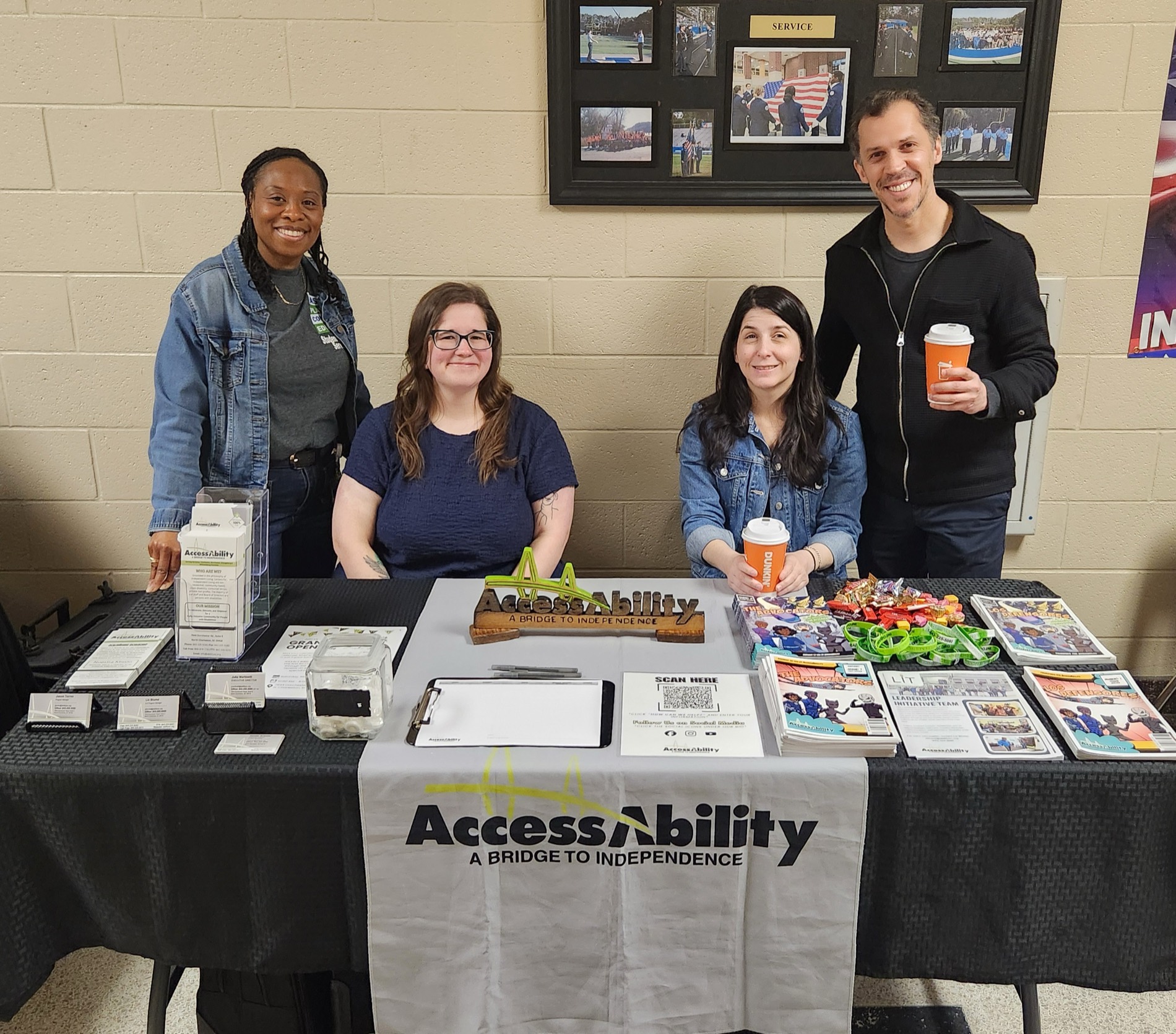 People connecting with services and exhibitors at an AccessAbility job and resource fair.