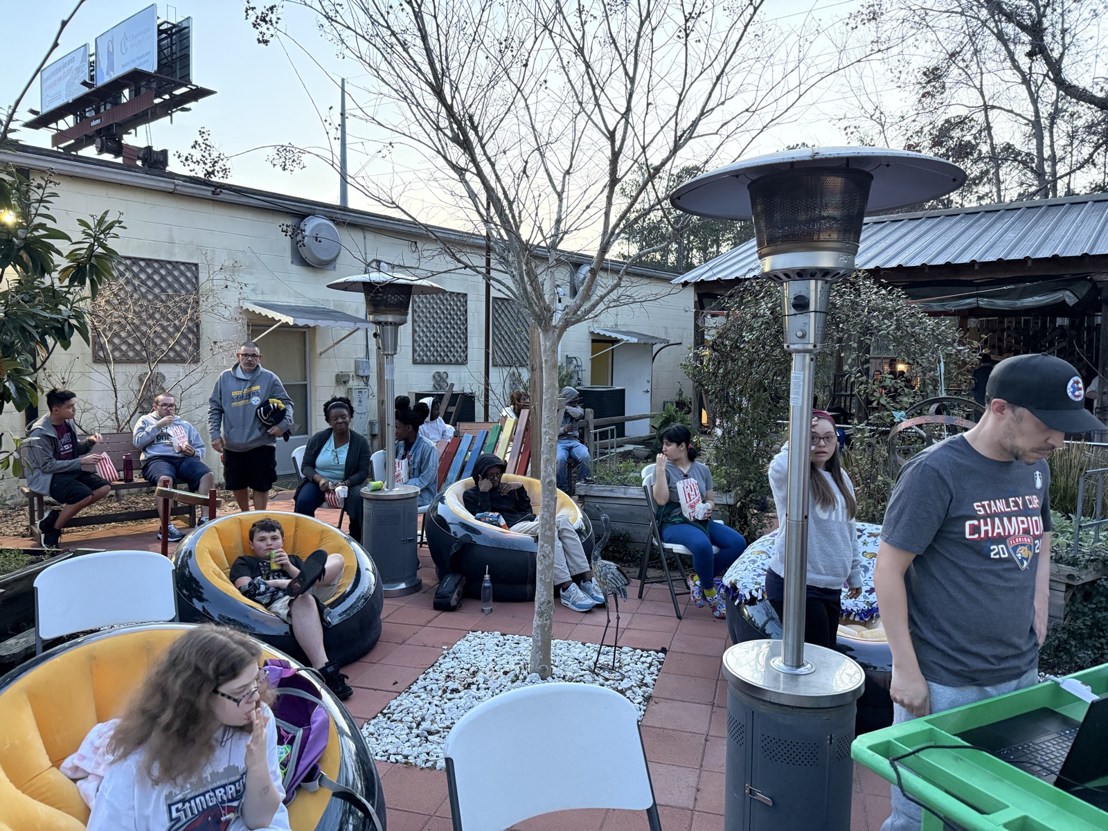 Community members gathered for a movie night in AccessAbility's courtyard hub.