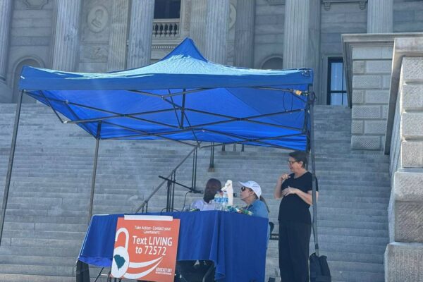 Advocacy Day guest speakers on the steps of the state capital.