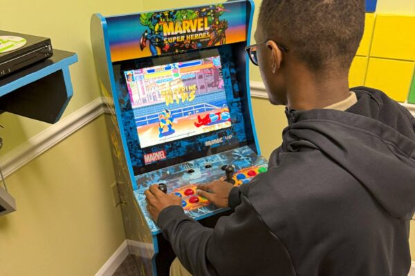 A LIT member playing a video game at Scotty's Place.