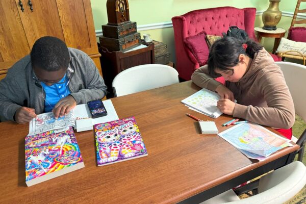 LIT members at a table coloring.