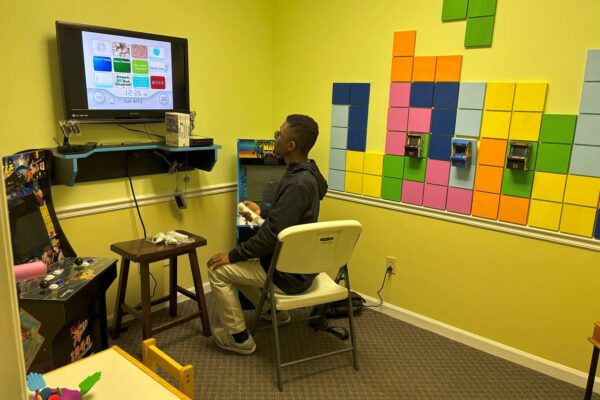 A LIT member playing a video game at Scotty's Place.