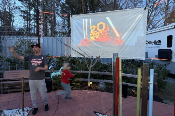 Jason from AccessAbility is introducing the movie for movie night.