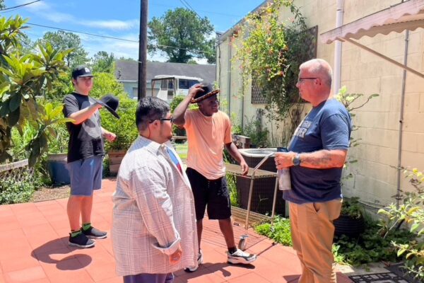 Tony from AccessAbility hanging out with summer session attendees in the sensory garden.