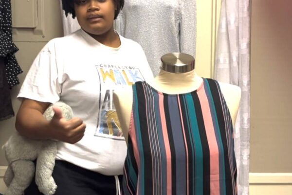 A summer session attendee participating in a sales pitch.